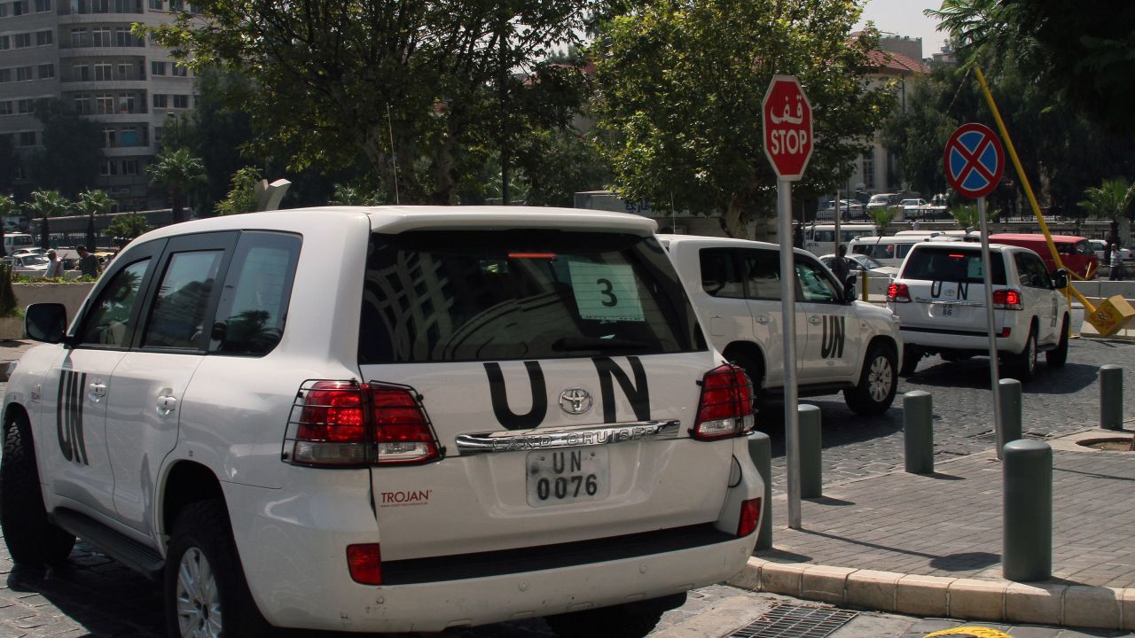 A convoy of United Nations (UN) vehicles leave a hotel in Damascus on August 26, 2013 carrying UN inspectors travelling to the site of a suspected deadly chemical weapon attack the previous week in Ghouta, east of the capital. The Syrian authorities approved the UN inspection of the site, but US officials said it was too little, too late, arguing that persistent shelling there in recent days had 'corrupted' the site.