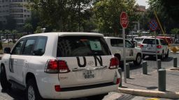 A convoy of United Nations (UN) vehicles leave a hotel in Damascus on August 26, 2013 carrying UN inspectors travelling to the site of a suspected deadly chemical weapon attack the previous week in Ghouta, east of the capital. The Syrian authorities approved the UN inspection of the site, but US officials said it was too little, too late, arguing that persistent shelling there in recent days had 'corrupted' the site.