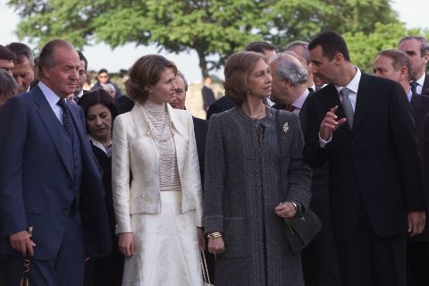 Syrian President Bashar al-Assad, right, and wife Amsa al-Assad, second from left, speak with the Spanish Queen Sofia and King Juan Carlos as they inaugurate the show "El Esplendor de los Omeyas Cordobeses," on May 3, 2001, in Cordoba, Spain. 