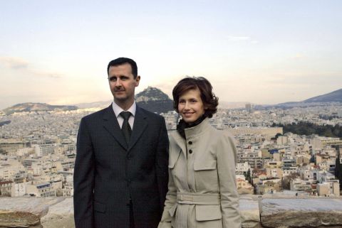 Bashar al-Assad and Asma al-Assad pose for photographers during their visit to Acropolis archaeological site in Athens, Greece, on December 15, 2003.           