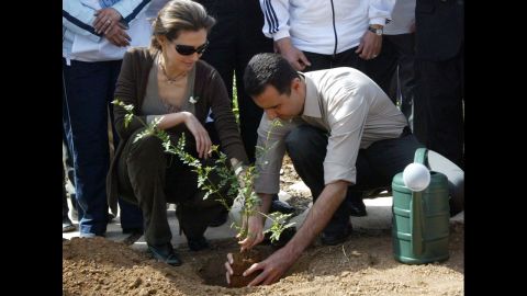 The Syrian first couple plant a jasmine bush in old Damascus on April 27, 2007.