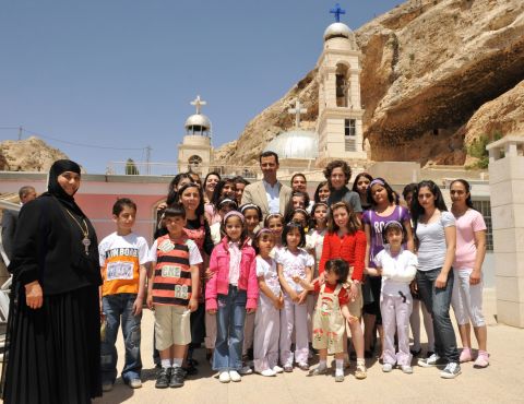The Syrian first couple celebrate Orthodox Easter with orphans at the Mar Taqla convent in the village of Ma'loula, Syria, on April 27, 2008. 