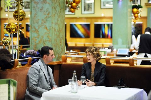 Asma al-Assad, right, and husband Bashar sit at the Coupole restaurant in Paris on December 10, 2010.