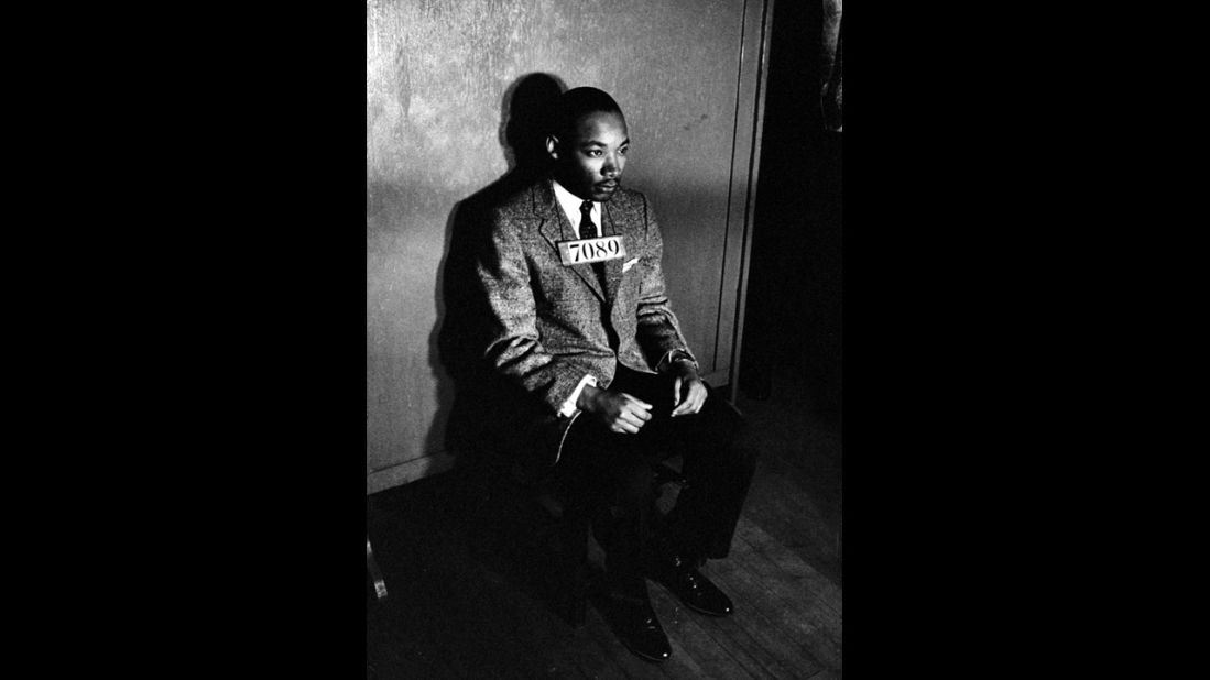 King sits for a police mugshot after his arrest for directing a citywide boycott of segregated buses on February 24, 1956. 