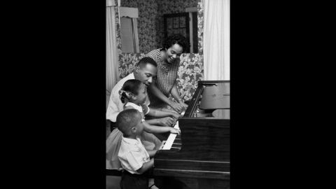 King, his wife and children, Yolanda, 5, and Martin Luther III, 3, play the piano together in their living room in Atlanta in 1960. 