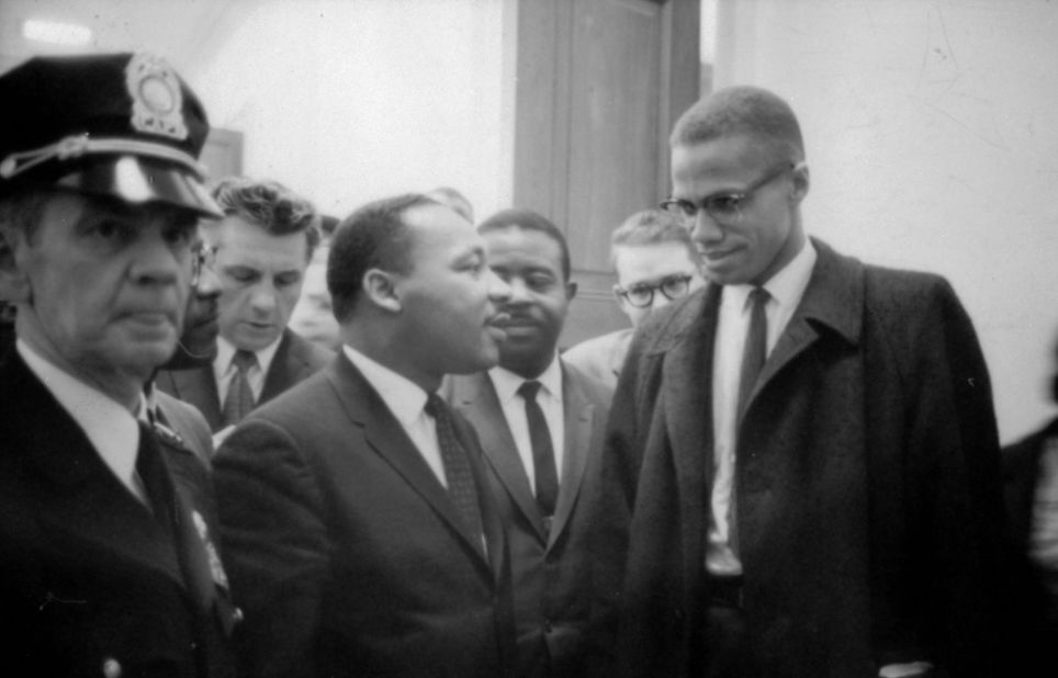 King speaks with Malcolm X at a press conference on March 26, 1964.