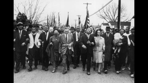 King and his wife lead a black voting rights march from Selma to Montgomery, Alabama, on March 30, 1965.