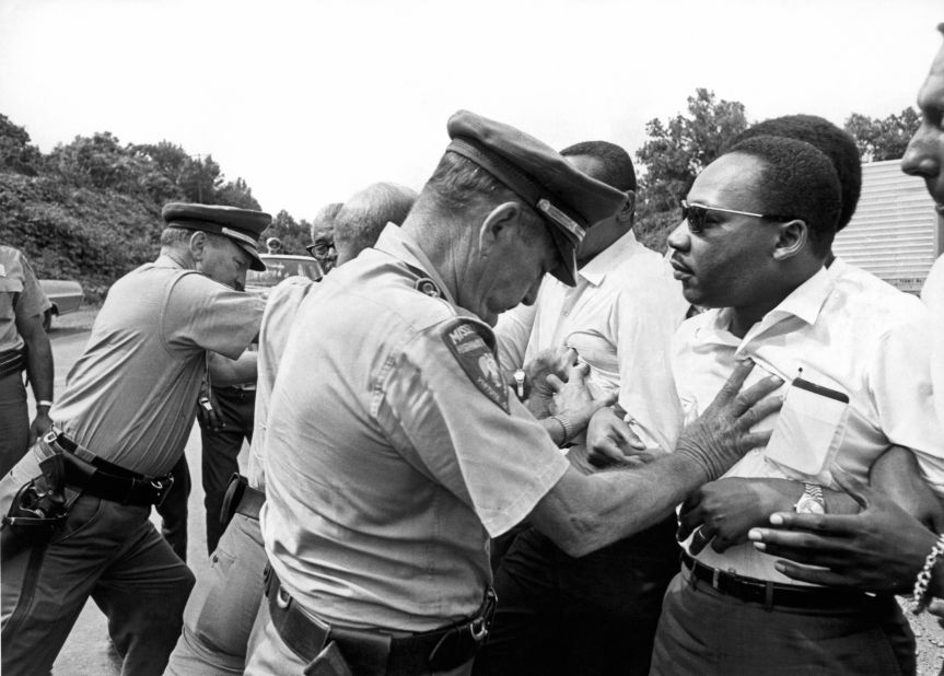 Mississippi patrolmen shove King during the 220-mile "March Against Fear" from Memphis, Tennessee, to Jackson, Mississippi, on June 8, 1966.