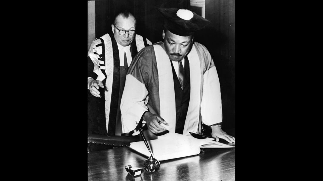 King signs the Degree Roll at Newcastle University after receiving an honorary Doctor of Civil Law degree, in Newcastle, England, on November 14, 1967.