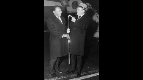 King and comedian Bob Hope, right, talk at John F. Kennedy International airport in New York on November 14, 1967.