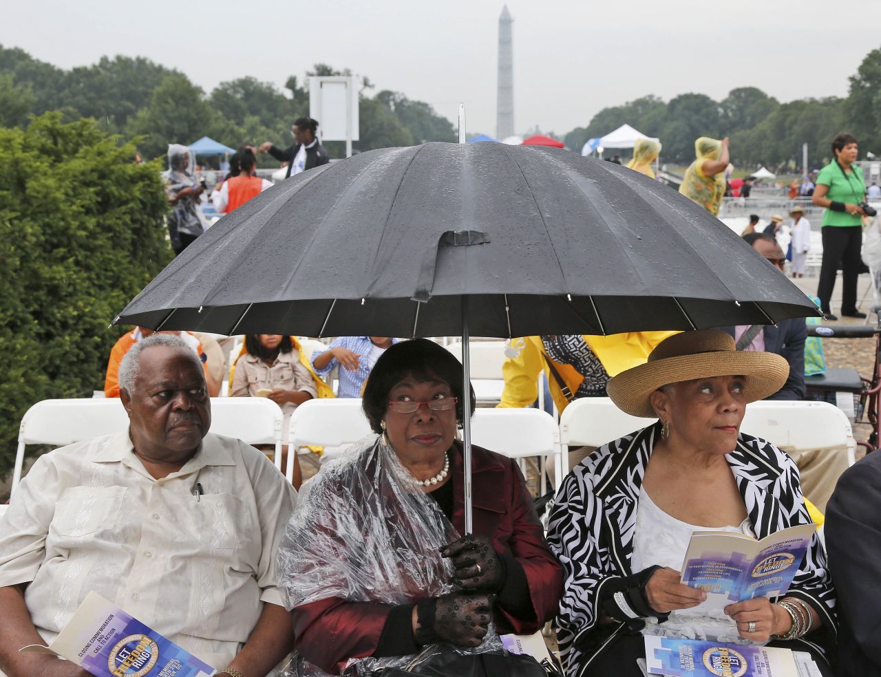 Stanley Samuels and Rita Samuels, from Atlanta,left, and Sammie Whiting-Ellis, from Washington, wait for the anniversary program to begin.