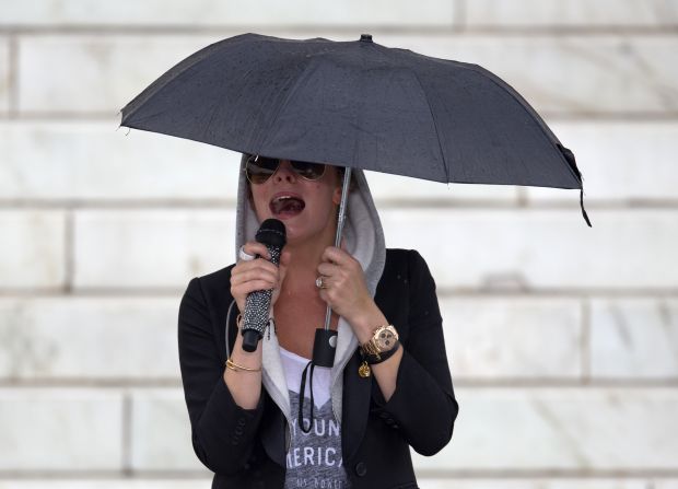 Country singer LeAnn Rimes sings "Amazing Grace" in preparation for her performance during the Let Freedom Ring ceremony, on the steps of the Lincoln Memorial in Washington an August 28.