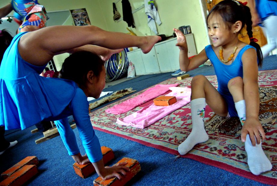 "In order to learn how to balance your body on your hands and on other people, you need to gain upper body strength. My homework used to be 300 push ups a day," said former contortionist Baasankhuu.