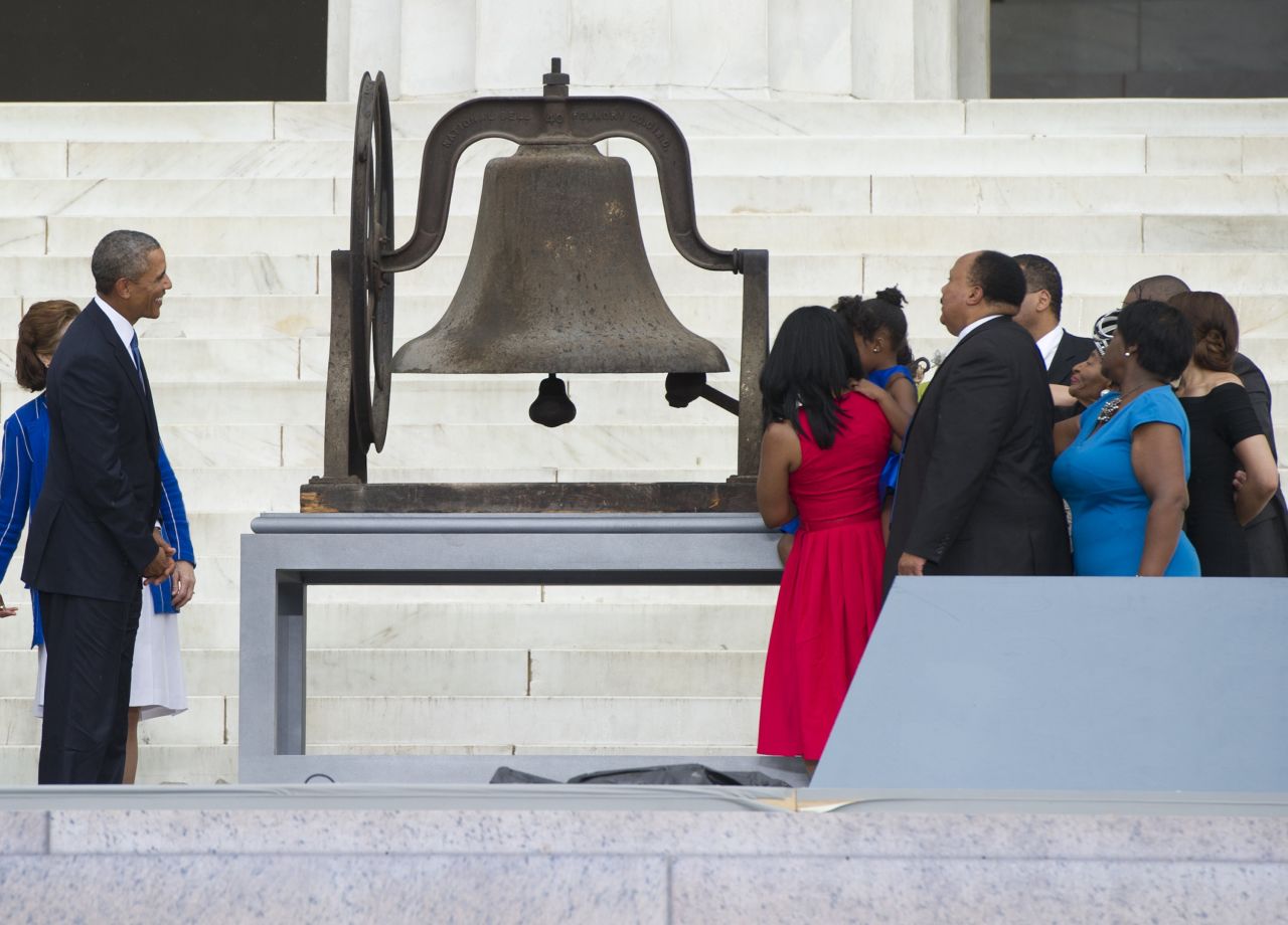 Members of the Rev. Martin Luther King, Jr's family ring a bell on Wednesday, August 28, as President Barack Obama watches, during the Let Freedom Ring Commemoration and Call to Action to commemorate the 50th anniversary of the March on Washington for Jobs and Freedom at the Lincoln Memorial in Washington.