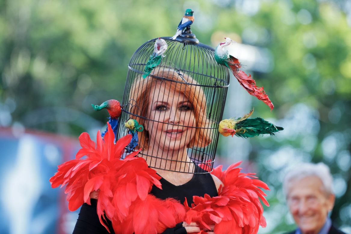 Marina Ripa di Meana wears a birdcage head ress for the screening of the film "Gravity."