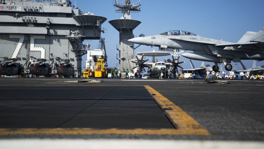 A picture released by the US Navy shows an F/A-18F Super Hornet assigned to the Swordsmen of Strike Fighter Squadron 32 performing a touch and go on the flight deck of the aircraft carrier USS Harry S. Truman (CVN 75) on August 15, 2013 in the Mediterranean Sea. US forces are "ready to go" if called on to strike the Syrian regime, Defense Secretary Chuck Hagel told the BBC on August 27, 2013, saying evidence pointed to its use of chemical weapons. The Pentagon chief said forces had been deployed as needed and President Barack Obama had reviewed military options presented by commanders. AFP PHOTO/US NAVY Lyle H. Wilkie III