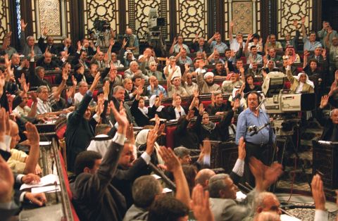 Syria's 250-member parliament approves by acclamation al-Assad's candidacy to succeed his late father as the country's president on June 27, 2000, in Damascus.