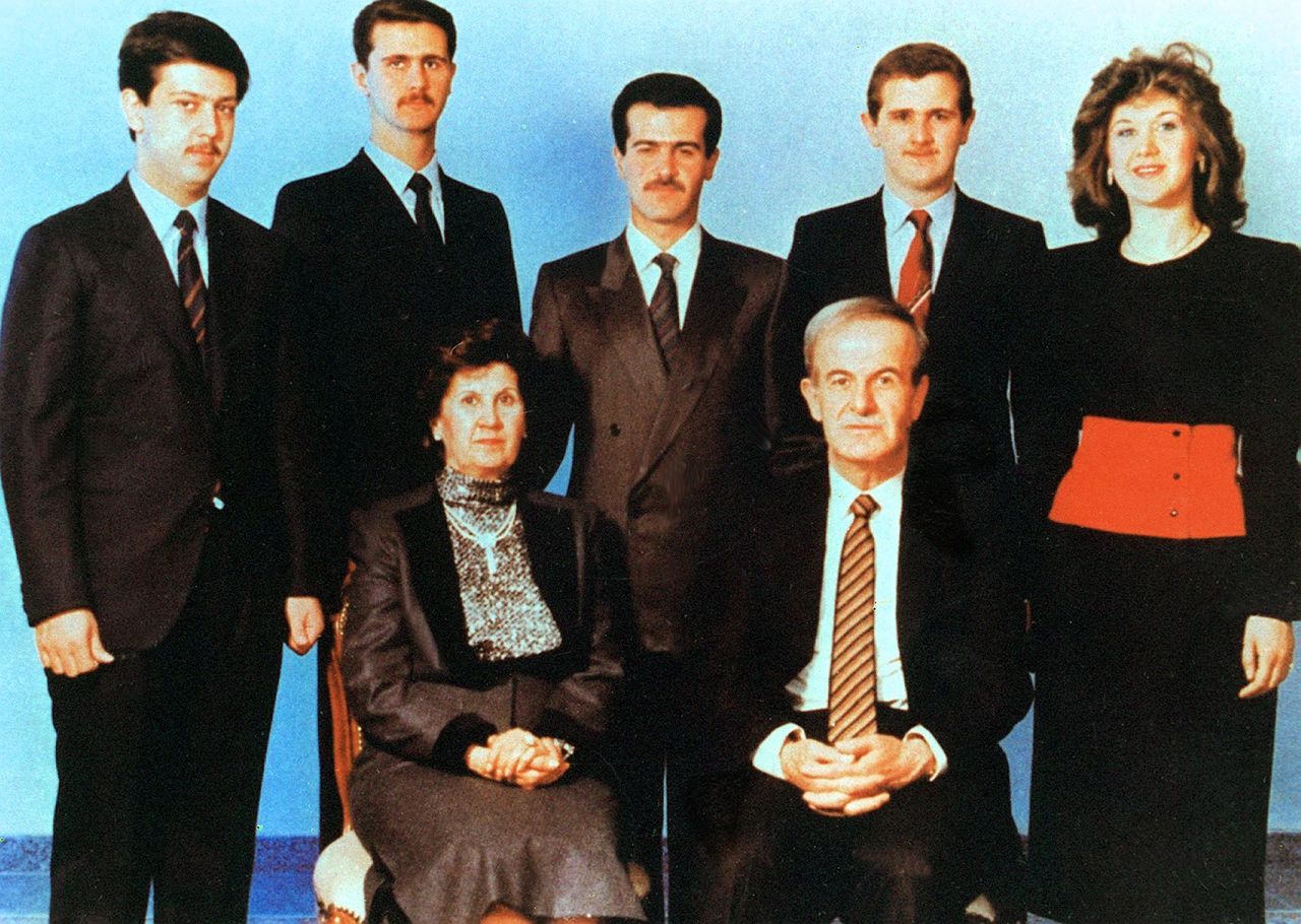 An undated photo shows current Syrian President Bashar al-Assad, second from left, posing with his family.  Al-Assad's parents, then-President Hafez Assad and his wife, Anisa, in front, and his siblings in the second row; Maher, Bassel, Majd and Bushra.
