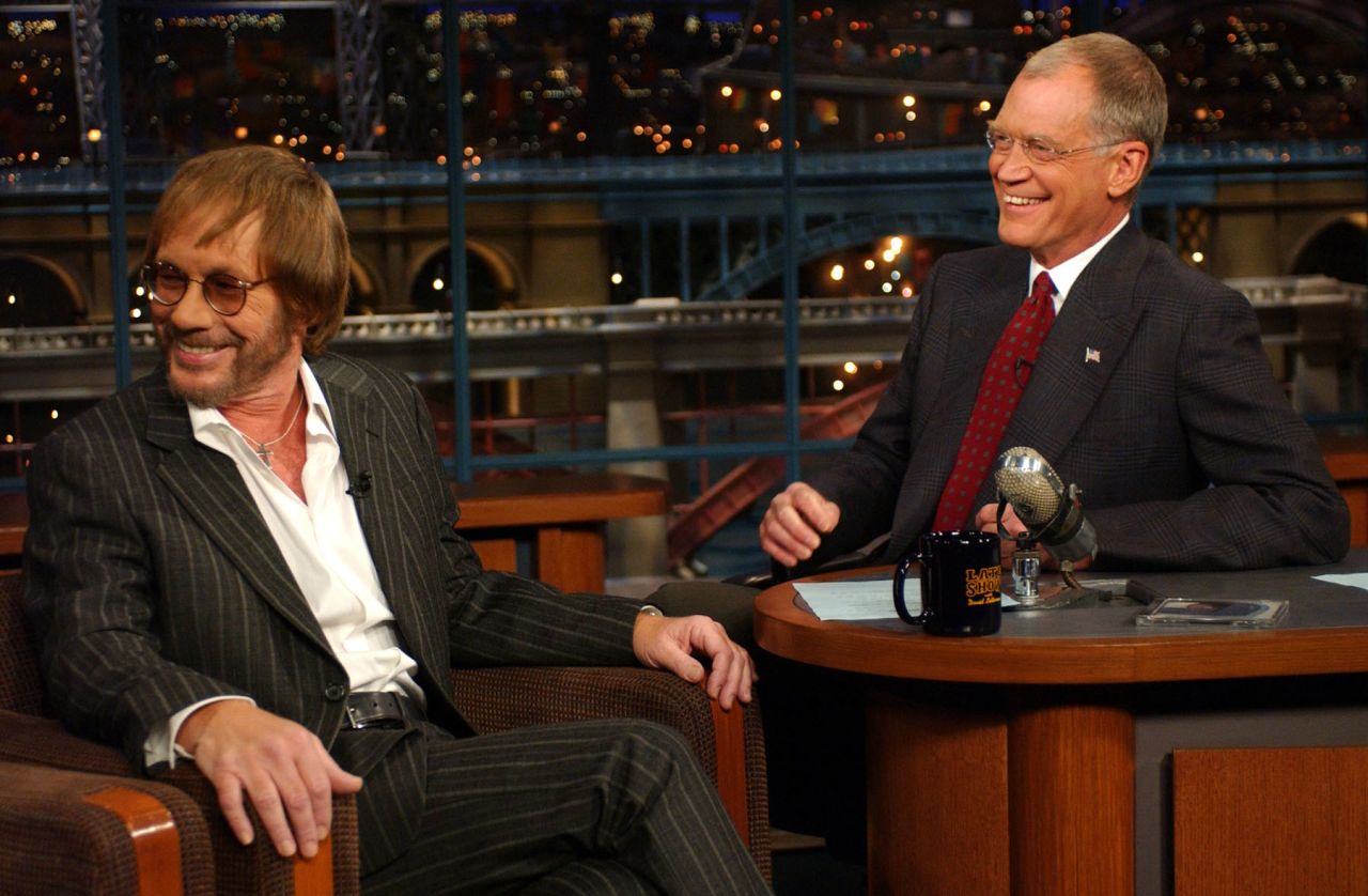 Born in Chicago, Grammy-winning singer/songwriter Warren Zevon -- seen here with late-night TV host David Letteman -- may be remembered most for his 1978 album, "Excitable Boy." Along with its Top 40 single "Werewolves of London," other tracks on the LP offer great examples of Zevon's imagination and humor, such as "Roland the Headless Thompson Gunner," and "Lawyers, Guns and Money." Singer Linda Ronstadt had a hit that same year with her cover of Zevon's "Poor, Poor Pitiful Me." Zevon died of cancer in 2003 at age 56. 