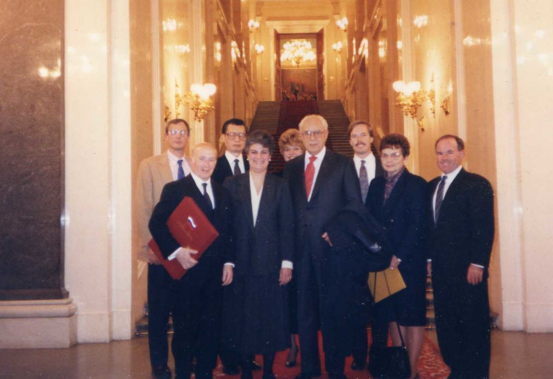 Hans Ephraimson-Abt, front left, and other KAL 007 family members pose with diplomats at the Kremlin in 1992 after gaining access to cockpit data for the first time.