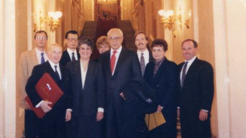 Hans Ephraimson-Abt, front left, and other KAL 007 family members pose with diplomats at the Kremlin in 1992 after gaining access to cockpit data for the first time.