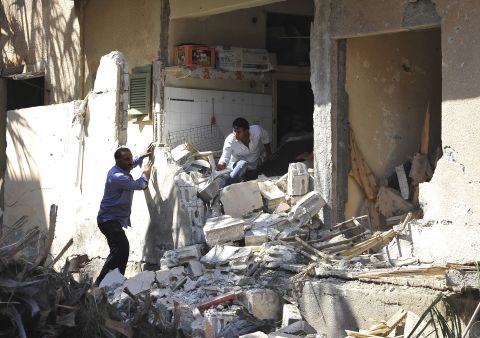 People search for belongings in rubble in Raqqa, Syria, on August 29.