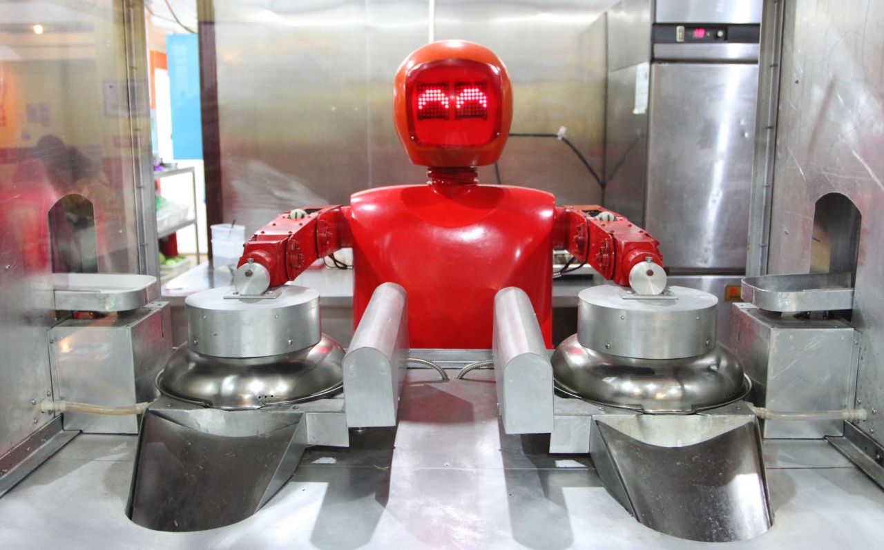 This robot is busy cooking up noodles at the world's first robot restaurant in Harbin, northeast China. Twenty robots perform a variety of chores, from ushering in guests to waiting tables and cooking dishes.