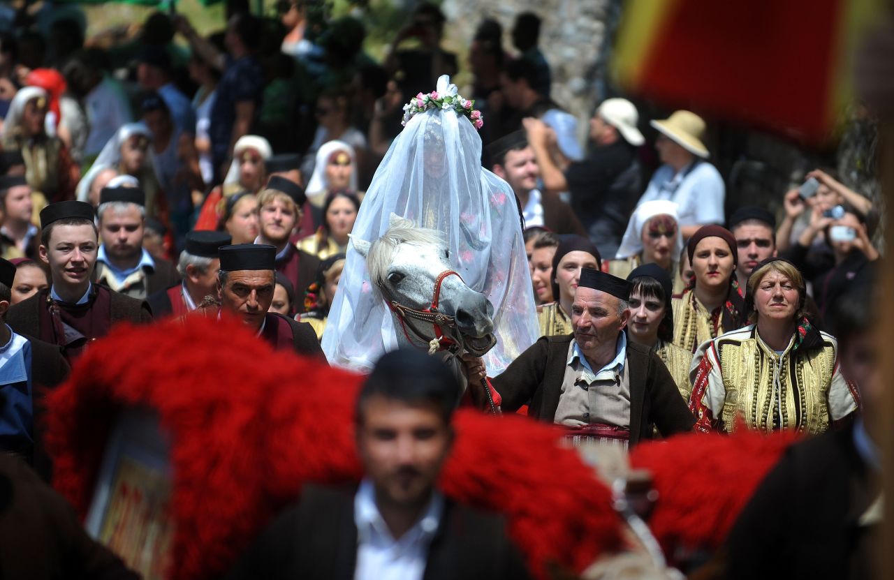A bride rides to church in the western Macedonian village of Galicnik.