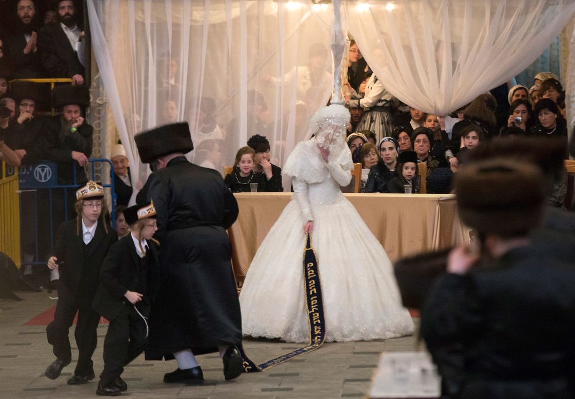 In Jerusalem, Hannah Batya Penet dances with her relative during her wedding to Rabbi Shalom Rokach, the grandson of the Belz rabbi.