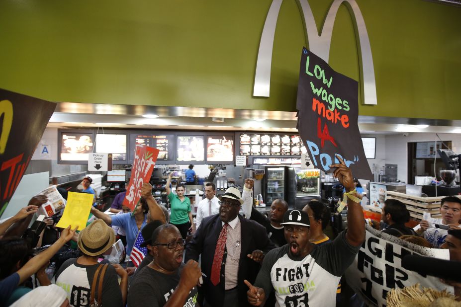 A protest organized by the Service Employees International Union takes place inside a McDonald's in Los Angeles on August 29.