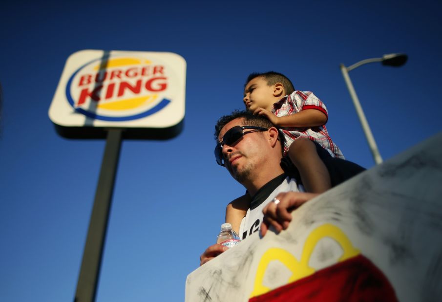 Demonstrators rally outside of a Burger King in Los Angeles on August 29.