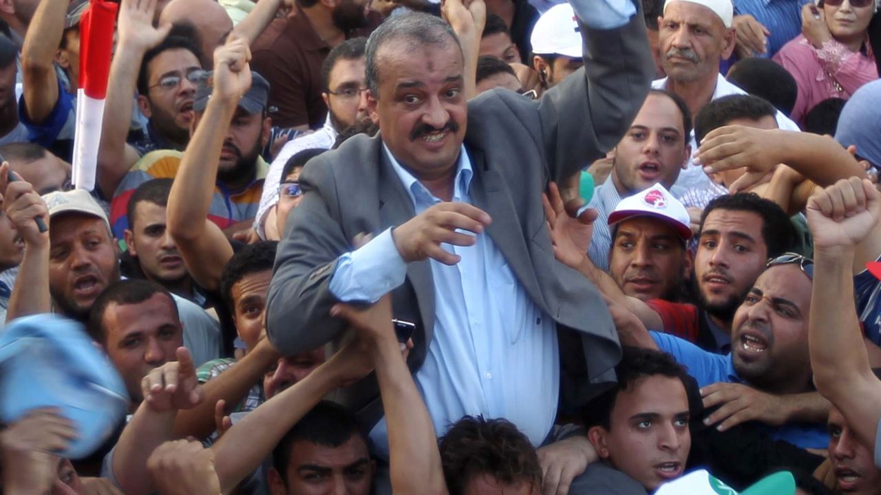 Mohamed El-Beltagi (C) is carried by supporters during a rally in Cairo's Tahrir square on June 5, 2012. 