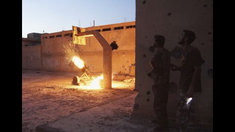 Free Syrian Army fighters launch a rocket toward forces loyal to Syrian President Bashar al-Assad in Deir Ezzor on August 29.