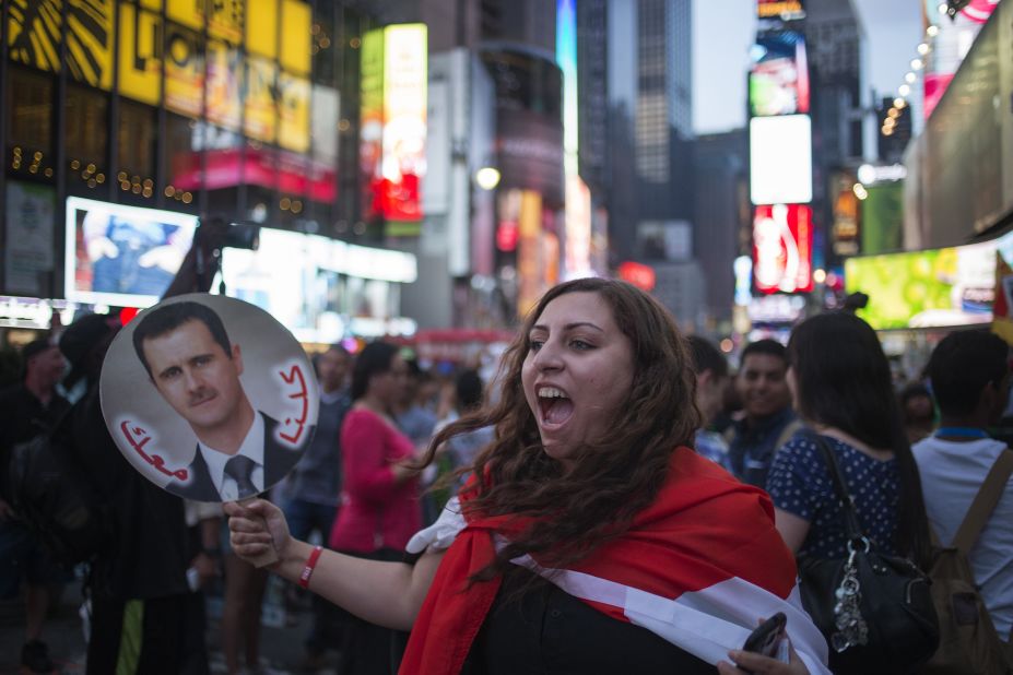 A Syrian-American supporter of Syrian President Bashar al-Assad participates in an anti-war rally in New York's Times Square on August 29.