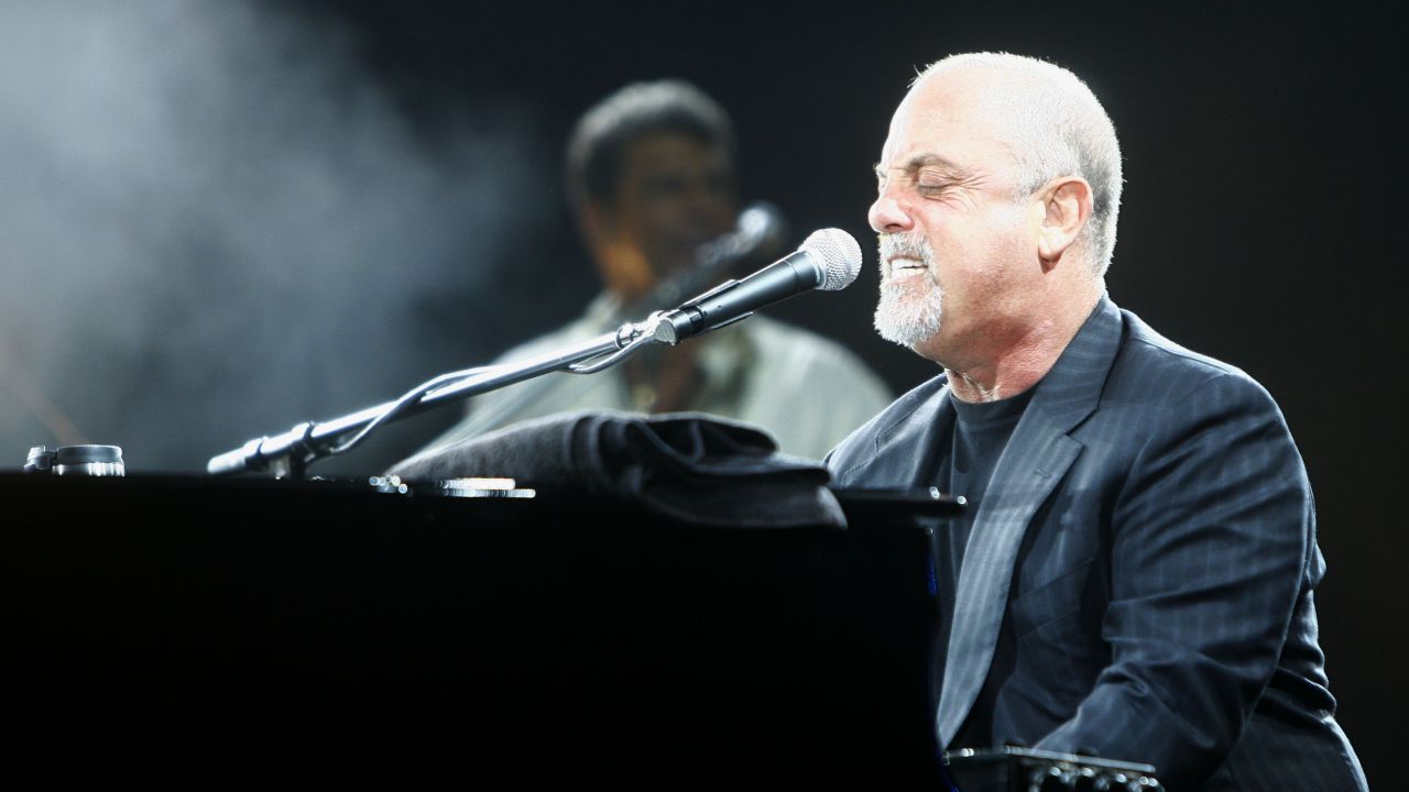 EAST HAMPTON, NY - Musician Billy Joel performs at the Hampton Social @ Ross at the Ross School on August 4, 2007, in East Hampton, New York. (Photo by Mat Szwajkos / Getty Images for Hampton Social @ Ross) 