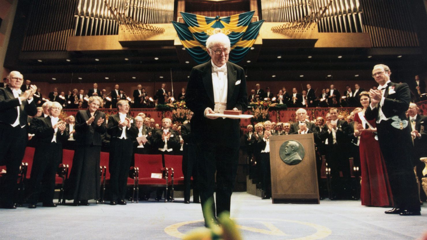 Seamus Heaney poses with the Nobel Prize for Literature he received from Sweden's King Carl Gustav XVI in December 1995.