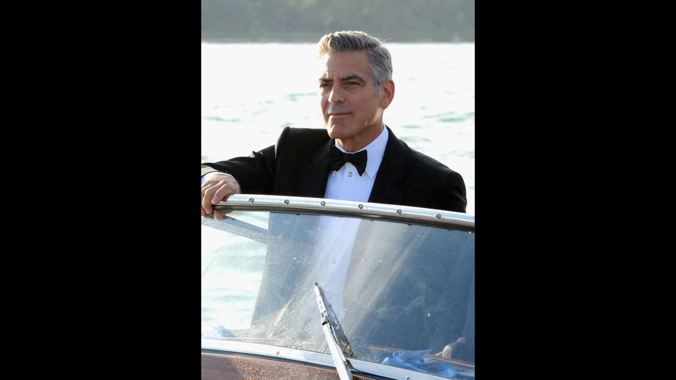 Actor George Clooney arrives by boat on  August 28.