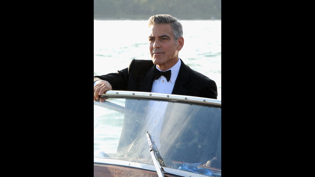 Actor George Clooney arrives by boat on August 28.