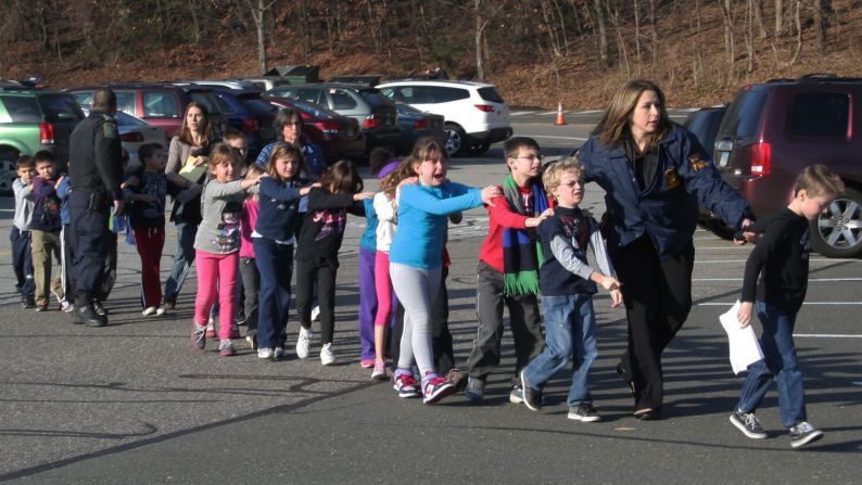 In the immediate aftermath of the 2012 shooting at Sandy Hook Elementary School, local journalist Shannon Hicks witnessed police escorting children out of the school in Newtown, Connecticut. "I knew that, coming out of the building -- as terrified as they were -- those children were safe," <a href="index.php?page=&url=http%3A%2F%2Flightbox.time.com%2F2012%2F12%2F20%2Fthe-story-behind-the-iconic-photograph-from-sandy-hook%2F%231" target="_blank" target="_blank">Hicks later told Time magazine</a>. "I just felt that it was an important moment." The photograph made it onto the front pages of newspapers, magazines and websites around the world.