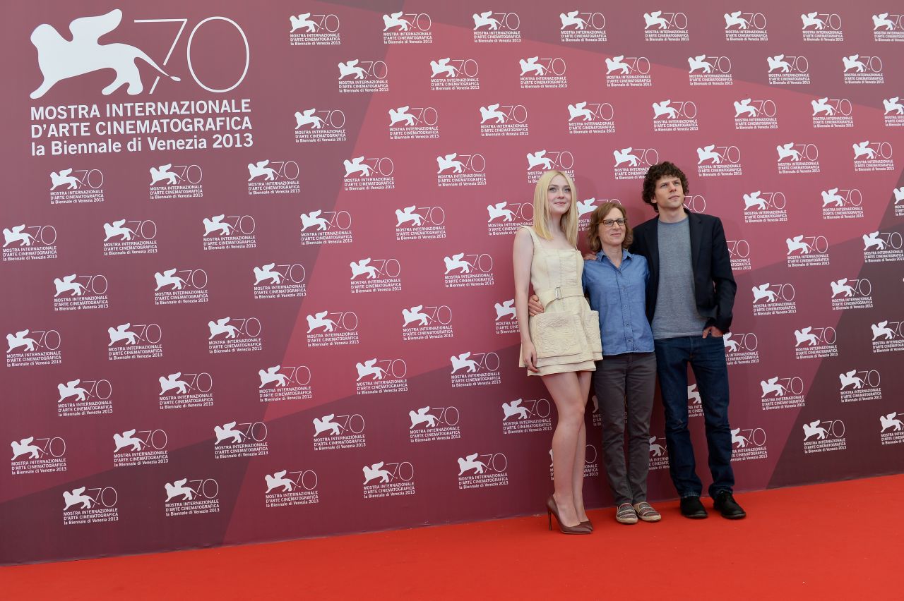 Actress Dakota Fanning, left, with director Kelly Reichardt and actor Jesse Eisenberg, pose during the photo call of "Night Moves," which was presented in the competition at the festival on August 31.