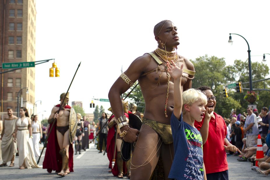 Young fans pose with a man dressed as King Xerxes from "300."