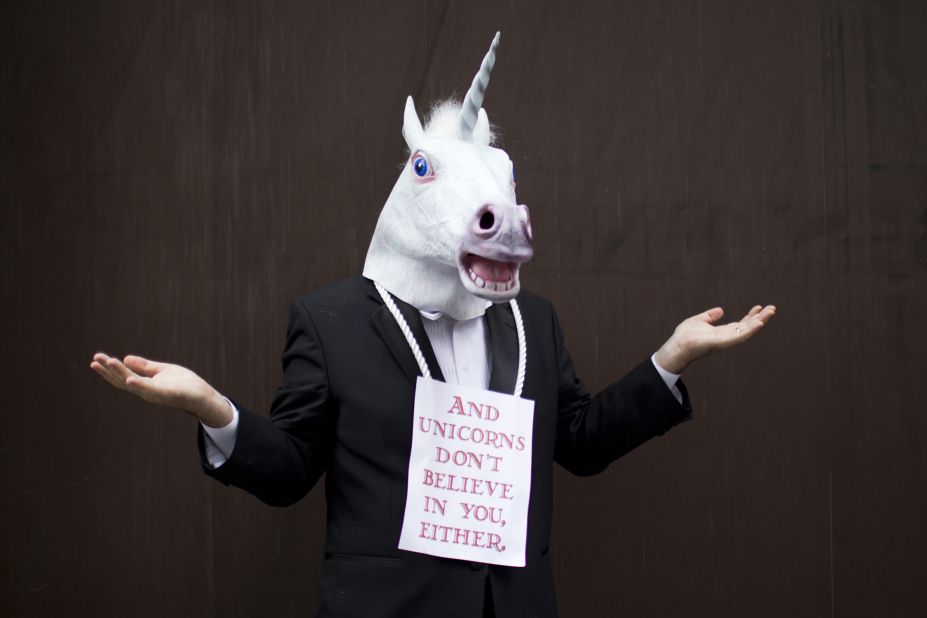 Ted Freeman attends the Dragon Con parade dressed as a unicorn.