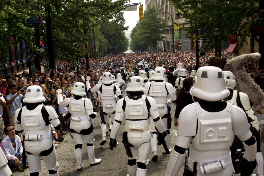 Stormtroopers from the 501st Legion, an international fan group dedicated to "Star Wars" villains, march through the streets of Atlanta.