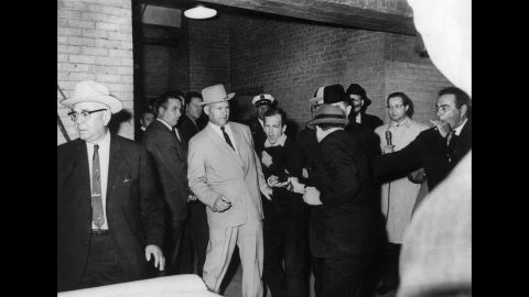 Two days after President John F. Kennedy was killed in 1963, Dallas nightclub owner Jack Ruby gunned down Lee Harvey Oswald, the alleged assassin. Photographer Robert H. Jackson, who covered the event's surrounding Kennedy's assassination, instinctively captured the moment and won a Pulitzer Prize. Ruby was later found guilty of murder. He appealed his conviction but died before the start of a new trial.