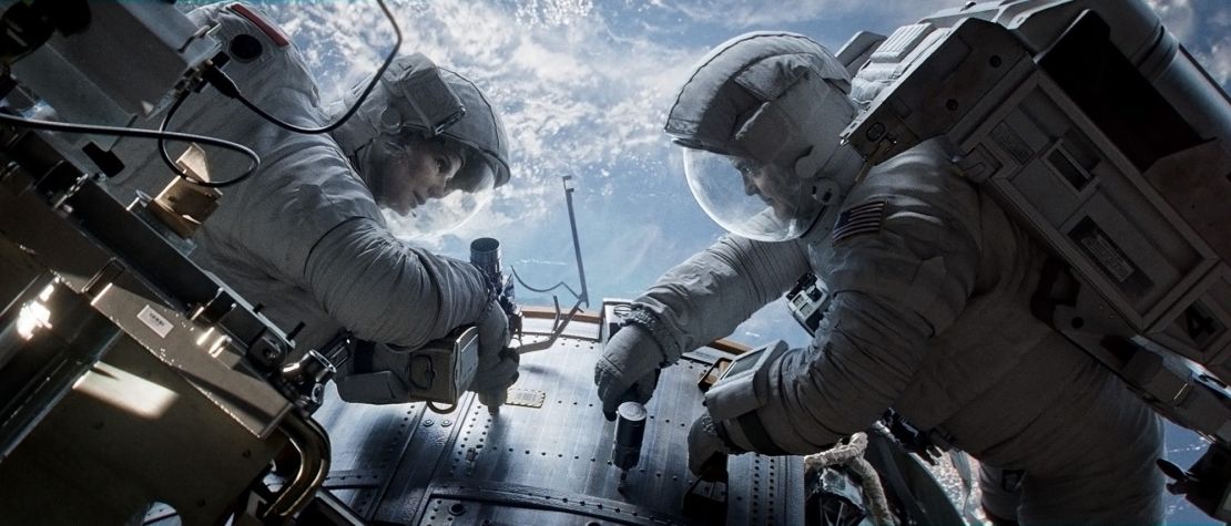 Sandra Bullock as Dr. Ryan Stone and George Clooney as Matt Kowalsky in "Gravity."