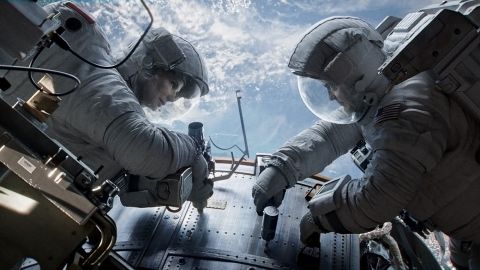 Sandra Bullock as Dr. Ryan Stone and George Clooney as Matt Kowalsky in "Gravity."

