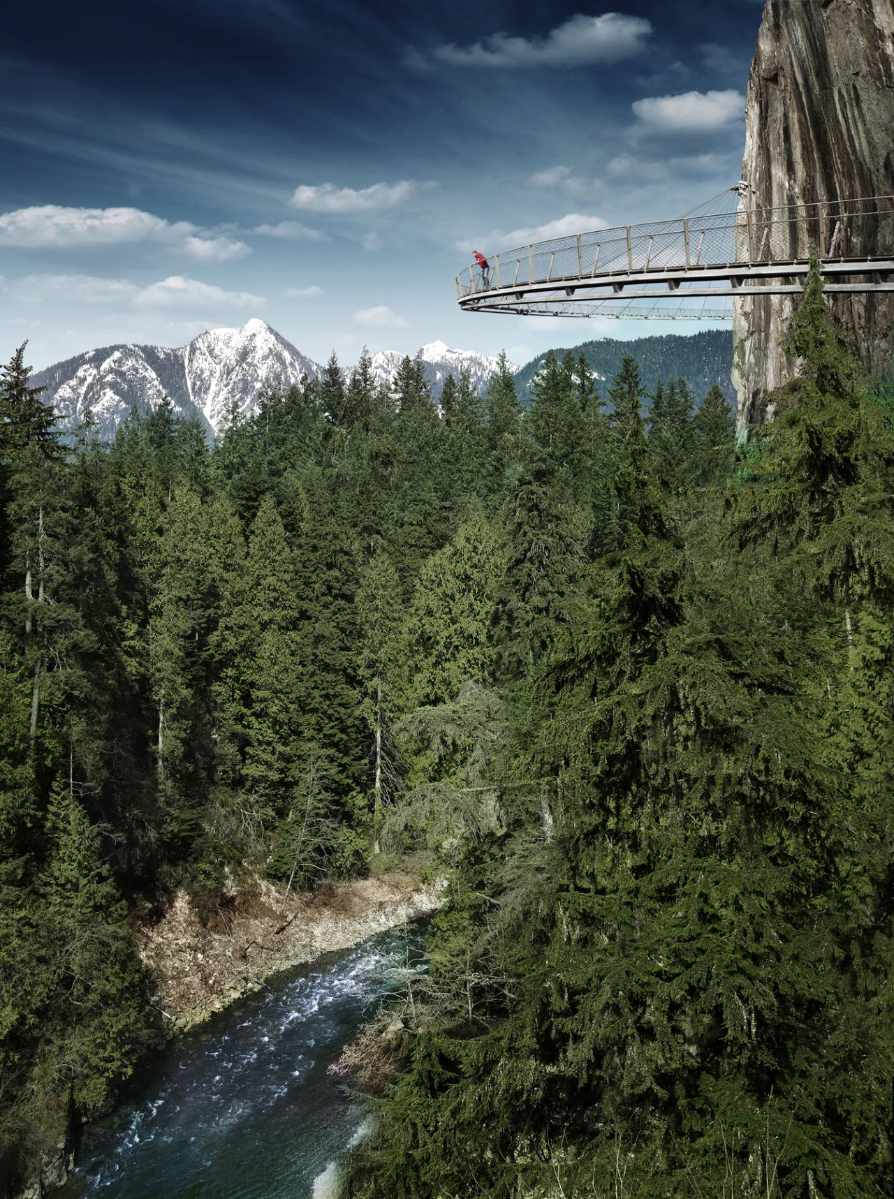 The Cliffwalk is a 700-foot (213-meter) walkway attached to a granite cliff face above the Capilano River in British Columbia. The highest point is 300 feet (90 meters) above the river.