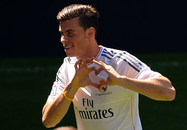 Gareth Bale shows the love for his new club with his recently trademarked heart hand sign.  