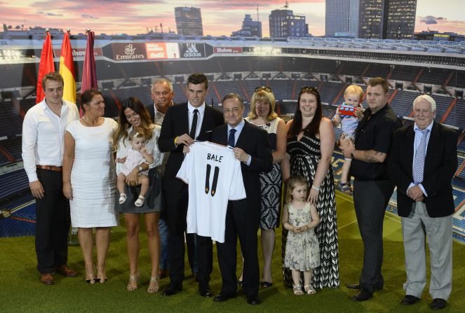 Members of Gareth Bale's family join the Welsh winger following his signing for Real Madrid. Girlfriend Emma Rhys Jones is standing alongside (third left) the playmaker clutching his daughter Alba Violet Jones.