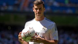 Gareth Bale poses for photographs in his new Real Madrid shirt during his official unveiling at estadio Santiago Bernabeu on September 2, 2013 in Madrid, Spain.